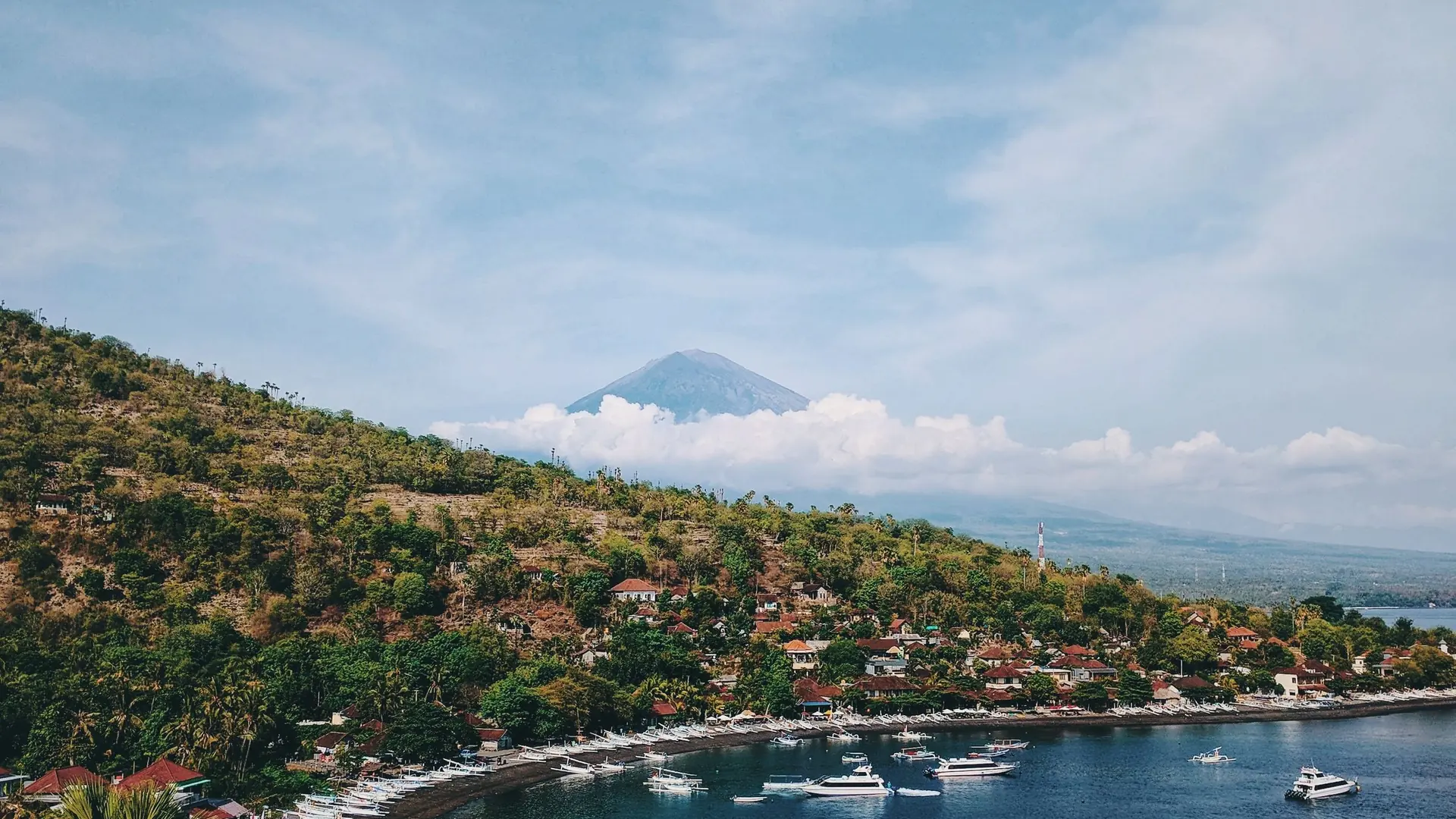 The Amed coastline with Mount Agung rising above the hills